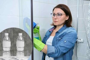donna pulisce box doccia con aceto